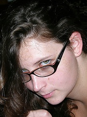 Brunette Woman Wearing Glasses Models Nude